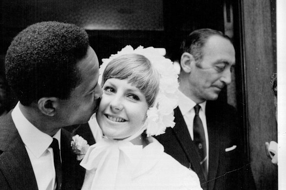 Cricket star Gary Sobers kisses his bride, Pru Kirby after their wedding in 1969.