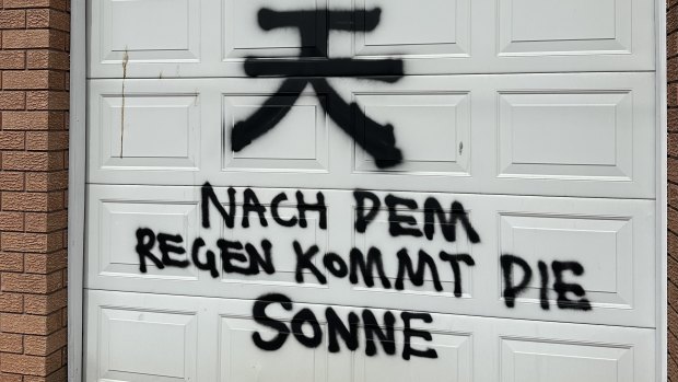 The graffiti included the Chinese symbol for “sky” or “day” above a German phrase which translates to “after the rain comes the sun”.