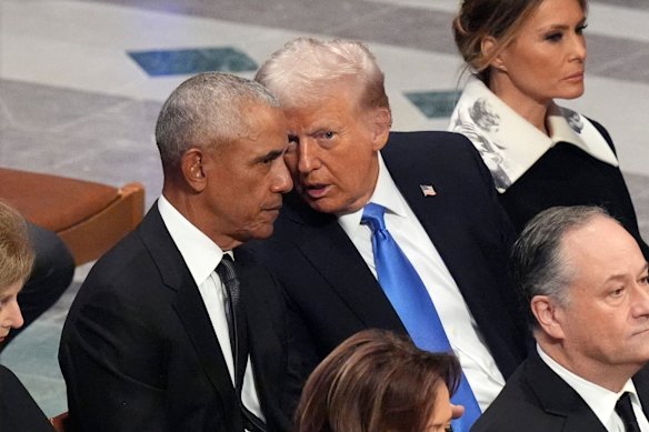 Former President Barack Obama talks with then President-elect Donald Trump at the state funeral for Jimmy Carter in Washington on January 9, 2025.