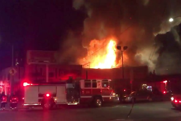 A fire breaks out at a warehouse dance party in Oakland, California, in December 2016.