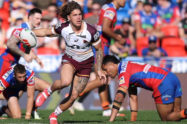 Reece Walsh leaves defenders in his wake.