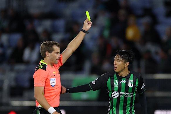 Referee Alex King shows the yellow card to Riku Danzaki of Western United during the round 28 A-League Men match between Western United and Sydney FC at Ironbark Fields, on April 27, 2025.