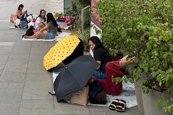 Some of the helpers hanging out on Orchard Road on Sunday.