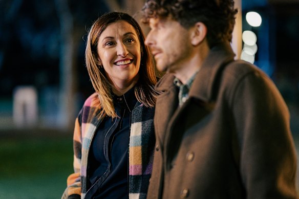 Celia Pacquola, as Samantha, welcomes Leon Ford’s Roland to the dog park community.