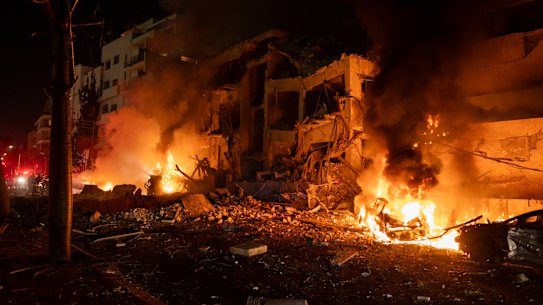 A fire burns after a missile strike hits central Tel Aviv.
