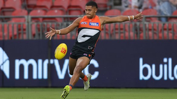 Josaia Delana of the Giants launches into a kick.
