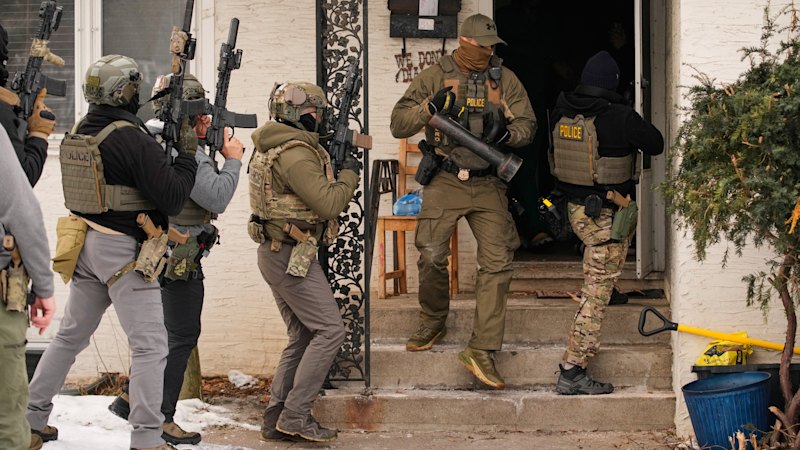 Protests erupt after woman killed and federal agents raid home