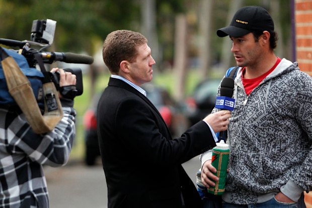 Channel 9 reporter Danny Weidler interviews Melbourne Storm player Brett White after a training session in 2010. 