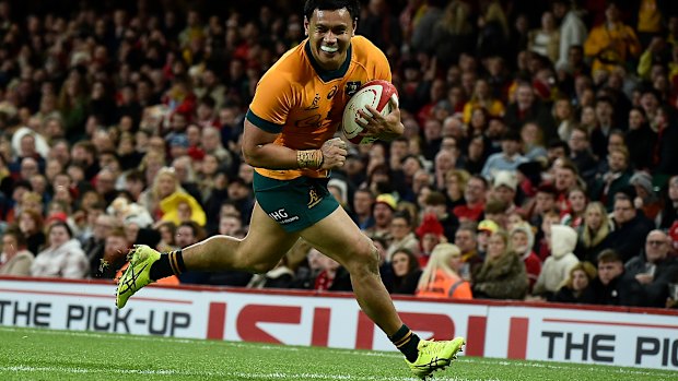 Len Ikitau scores against Wales last year.