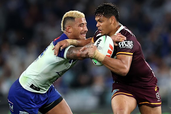 Canterbury’s Viliame Kikau tackles Brisbane’s Selwyn Cobbo on Friday night.