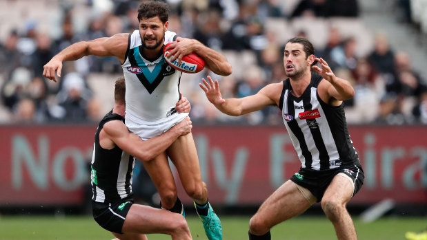 Flashback: Then Collingwood teammates Taylor Adams and Brodie Grundy get busy in 2017.
