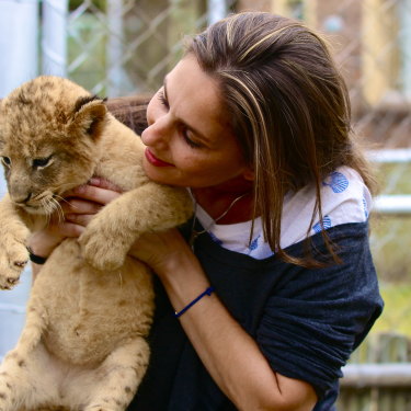 Petting a cub in a so-called sanctuary: at the time, Rubin was unaware that many animals here were destined to be shot in “canned” hunts. 