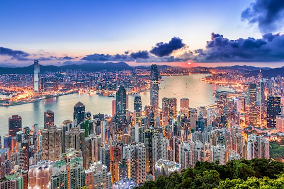 Hong Kong’s harbour, viewed from a famous landmark, The Peak, at sunrise. 