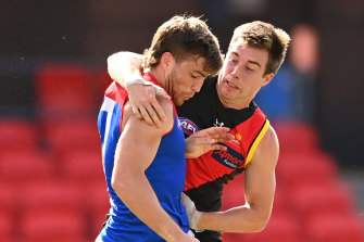 Zach Merrett, right, is returning to the Bombers' leadership group after a hiatus. 