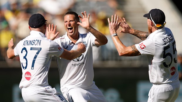 Brydon Carse celebrates the wicket of Usman Khawaja.