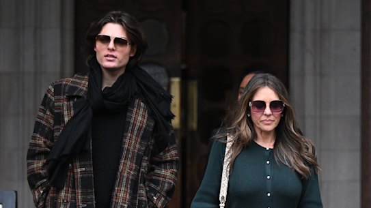 Hurley outside court with her son, Damian.