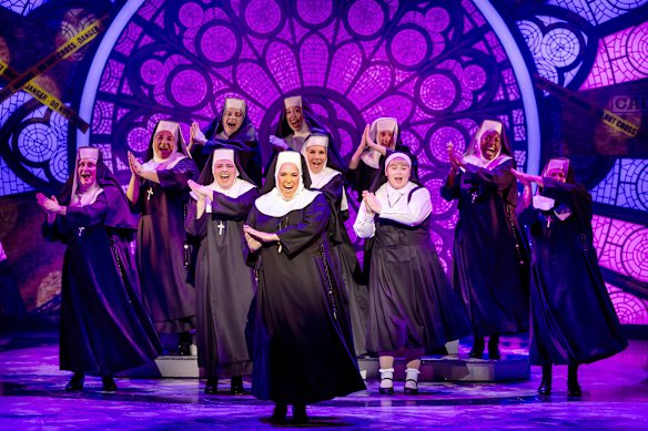 Casey Donovan (centre) leads the cast of Sister Act at QPAC, where events were still proceeding as of Tuesday.
