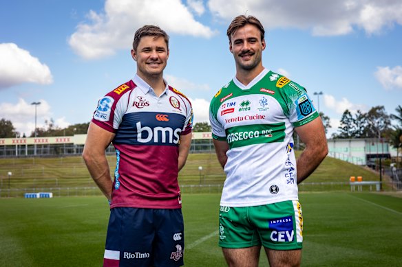 Queensland Reds centre Josh Flook (left) with teammate John Bryant (right), who is pictured in a Benetton jersey.