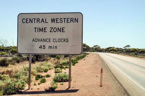A sign flags the unofficial Australian Central Western Time Zone on the Eyre Highway across the Nullarbor Plain.