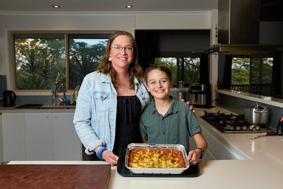 Kenmore residents Rebekah and Tex Treloar volunteer for a charity making lasagne for those in need.