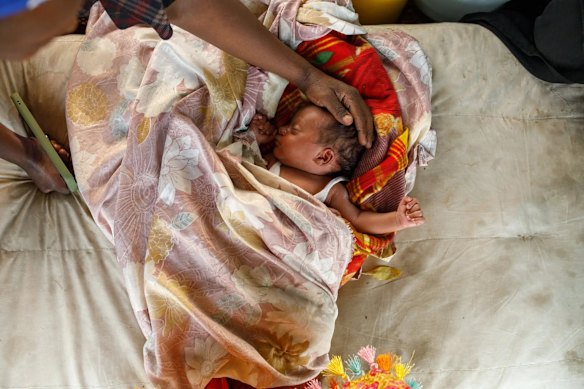 Kenyan mother Esther and her newborn son, Abudy.