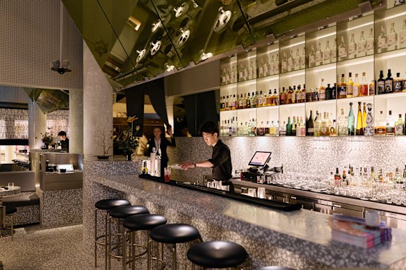A noren curtain separates the new bar and dining area from the original restaurant.