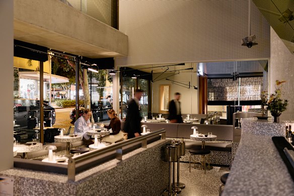 The new dining area features a terrazzo bar, mirrored features and banquette seating.