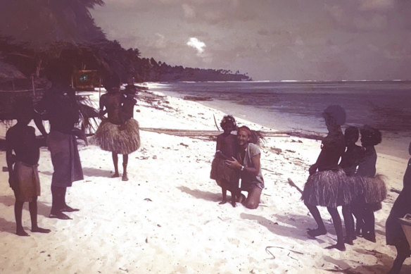 One of the crew, Graeme Johnson, with locals in PNG.