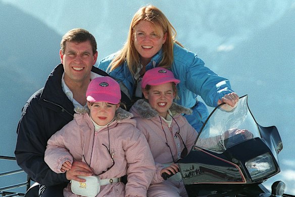 Andrew and then wife Sarah Ferguson pose with their daughters Eugenie, left, and Beatrice in Verbier, Switzerland in 1998.