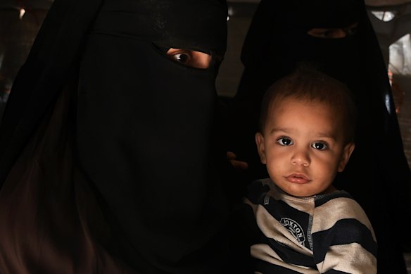 Australian Zahra Ahmed with her son Ibrahim in the al-Hawl camp in north-east Syria in 2019. 