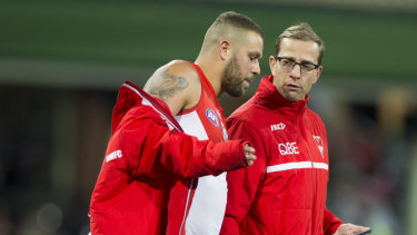 Lance Franklin (left), seen here with Swans football manager Charlie Gardiner, has suffered multiple hamstring issues this season.