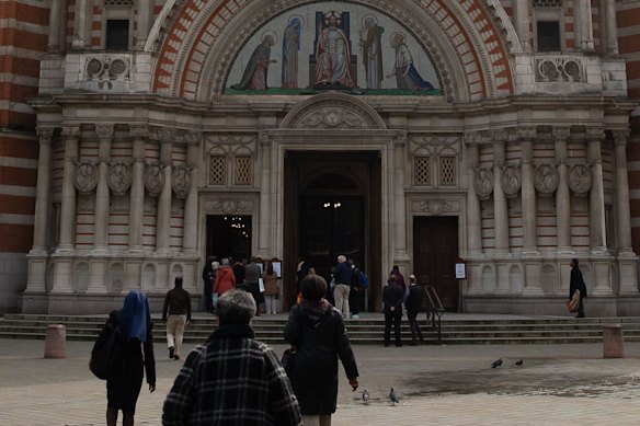 People arrive for Catholic Mass at Westminster Cathedral in London.
