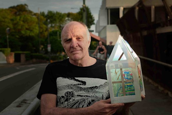 Zio Ledeux holds the lantern he uses to illuminate the Erksineville Road bridge.