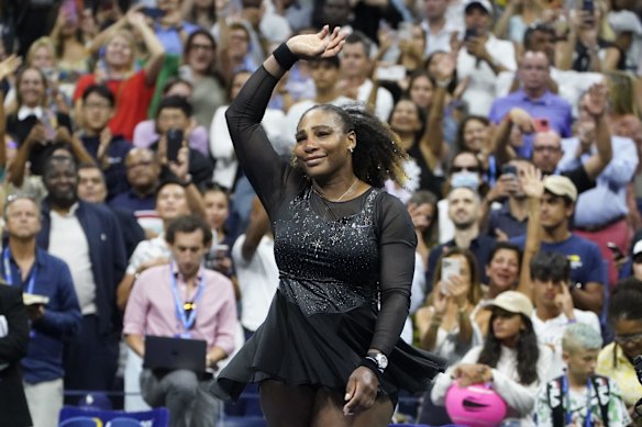 Serena Williams, of the United States, spins as she waves to fans after losing to Ajla Tomljanovic, of Austrailia, in the third round of the US Open in 2022.