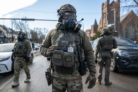 Heavily armed federal law enforcement agents during an immigration raid in south Minneapolis earlier this week.