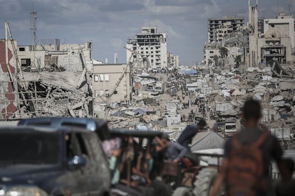Palestinians head north along al-Rashid Street towards Gaza City.