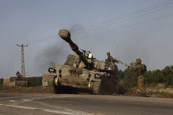 An Israeli tank moves towards the border with Gaza.