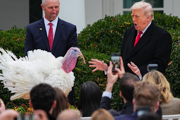 US President Donald Trump pardons Gobble, the 2025 National Thanksgiving Turkey, during a ceremony in the Rose Garden of the White House in Washington.