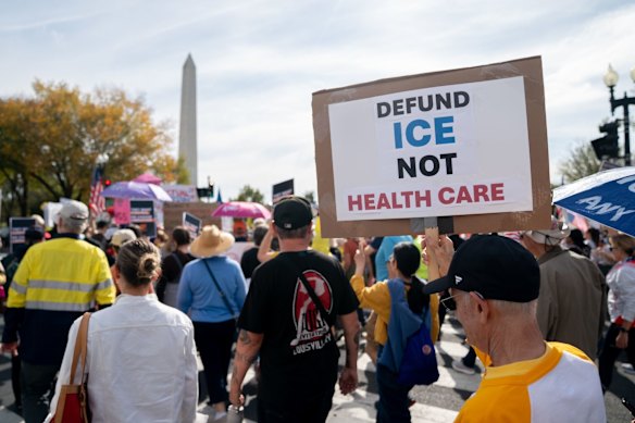 Demonstrators march near the Washington Monument during a “No Kings” protest.