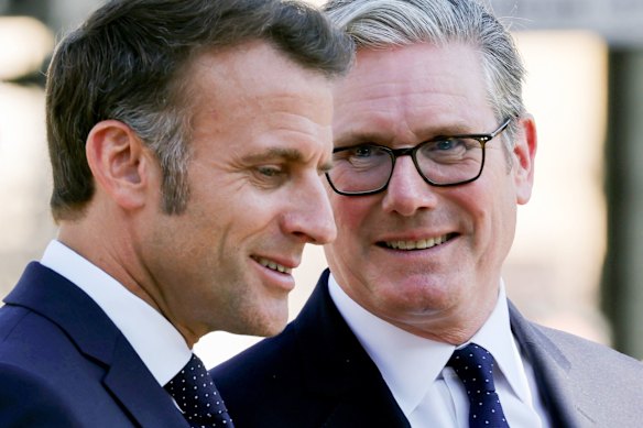 Macron with UK Prime Minister Keir Starmer earlier on Tuesday in London. 