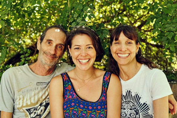 Sofia Levin (centre) with her father, Greg, and mother, Abby.
