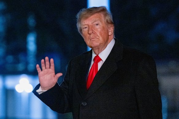 US President Donald Trump walks on the South Lawn of the White House on Saturday evening.