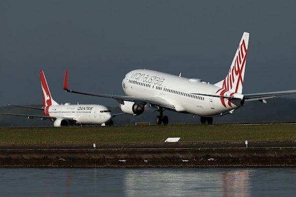 A file photo of a Virgin 737 and a Qantas 737 in Sydney.
