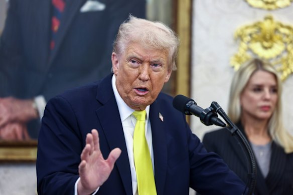 Trump speaks to reporters in the Oval Office on Wednesday.