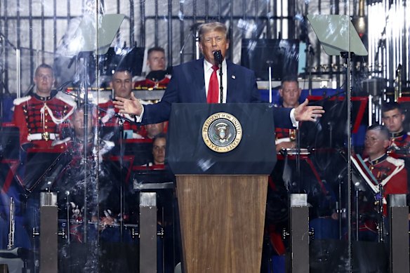 Donald Trump, behind a bulletproof shield, addressed the Great American State Fair in Washington on Wednesday night.