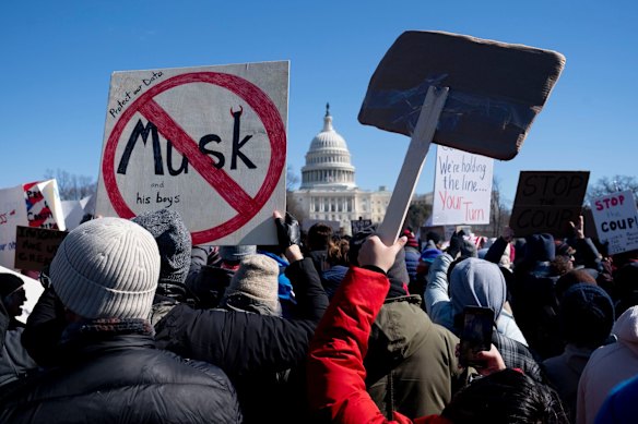 Protesters rail against Elon Musk’s DOGE  near the US Capitol in Washington in February.