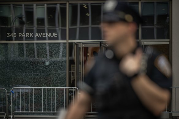 Police officers secure the scene of a shooting in Midtown Manhattan, New York.