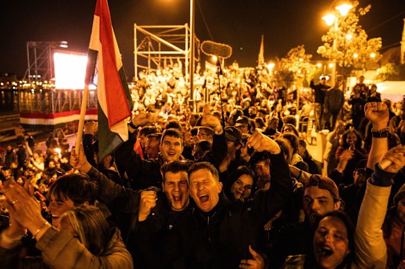 People celebrate during an election night party in Budapest, Hungary, on Sunday.