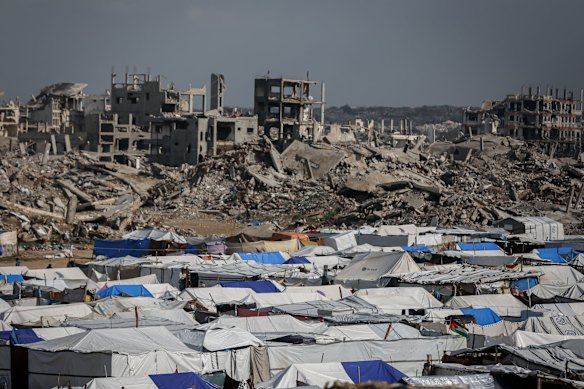 Displaced Palestinians are living in tents amid the rubble of Gaza City, which was largely destroyed by Israeli bombing.