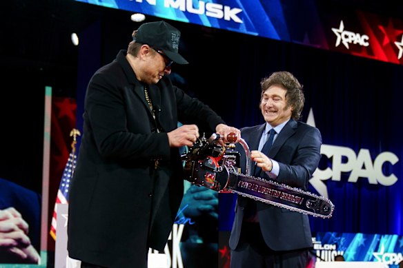 Javier Milei, Argentina’s president, right, presents a chainsaw to Elon Musk at a conservative conference in Washington.